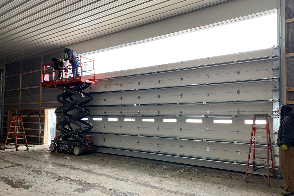 agricultural pole building commercial garage door Commercial overhead garage door on a pole building at a farm operation