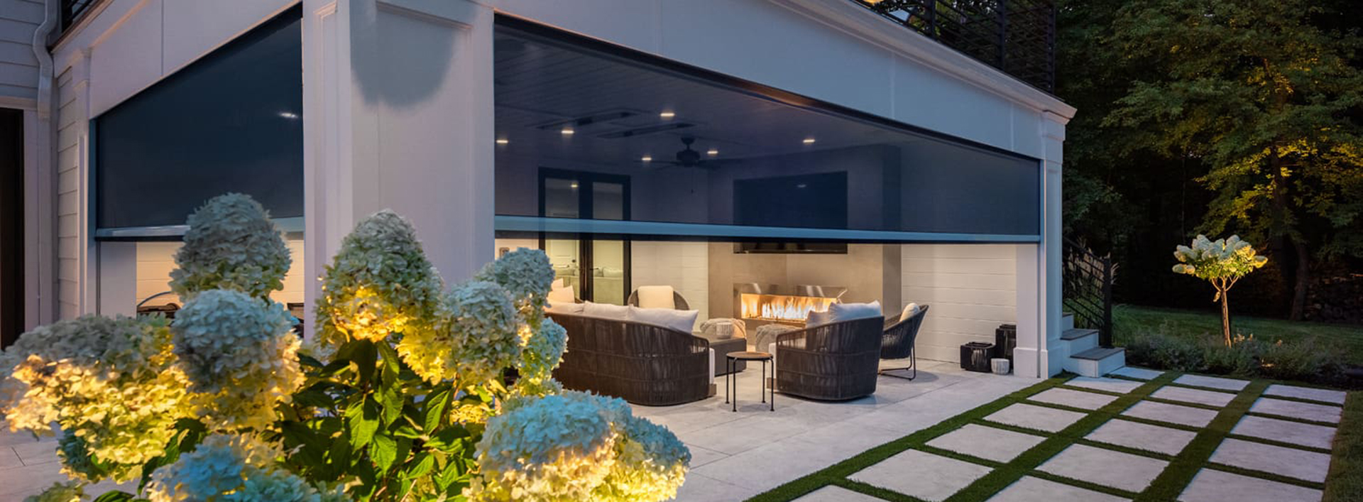 Retractable patio screen providing shade and pest protection for a poolside patio outdoor living space